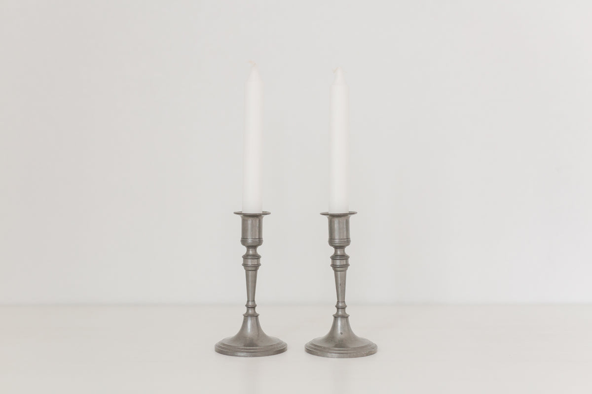 Vintage pair of pewter candle stick holders