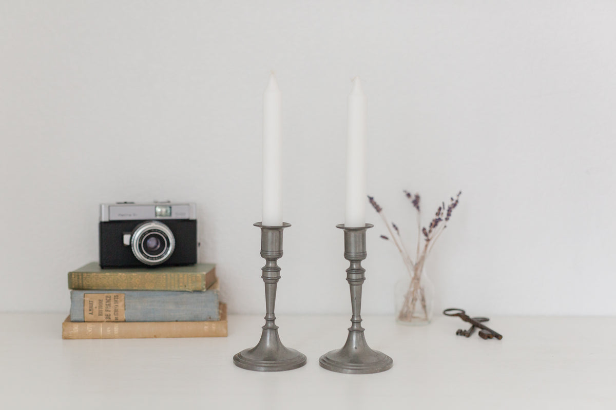 Vintage pair of pewter candle stick holders