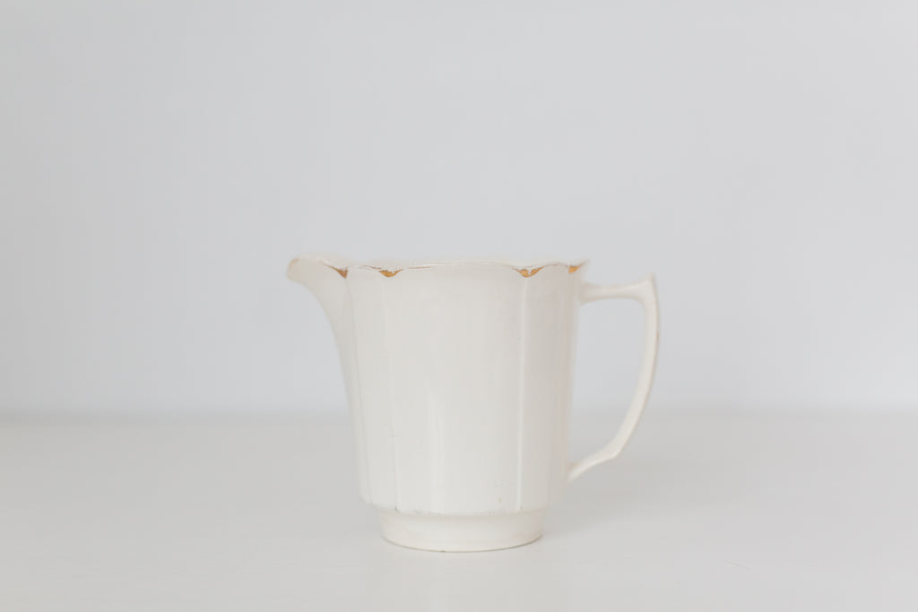Vintage cream K T & K pitcher with gold accents