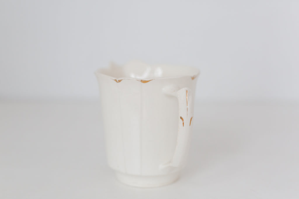 Vintage cream K T & K pitcher with gold accents