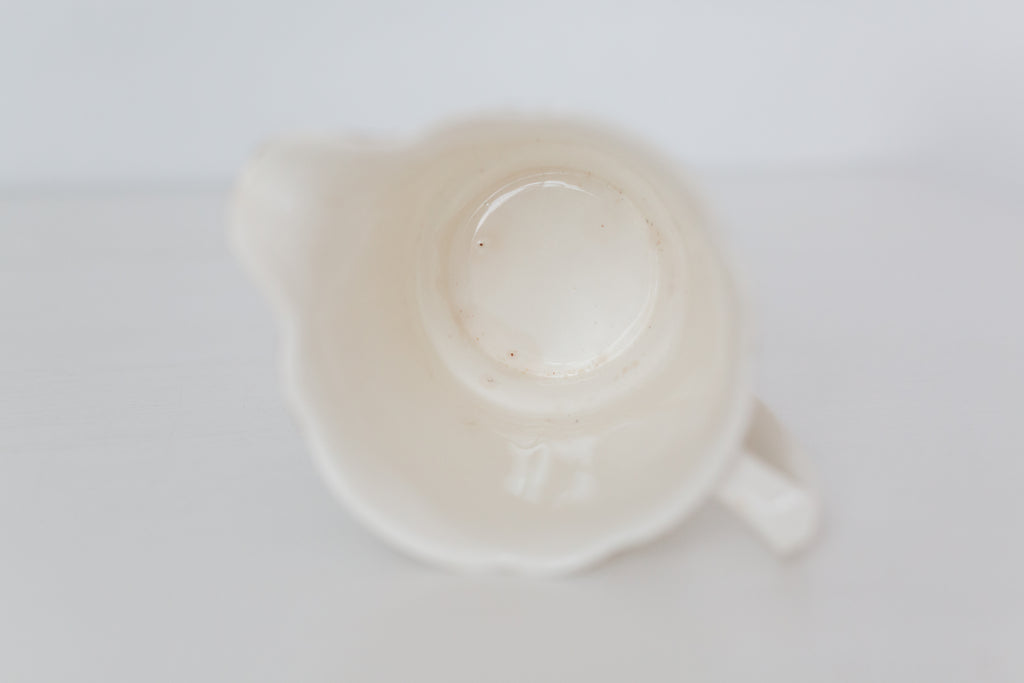 Vintage cream K T & K pitcher with gold accents