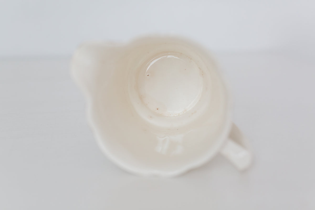 Vintage cream K T & K pitcher with gold accents