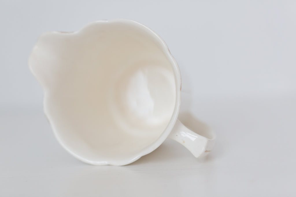 Vintage cream K T & K pitcher with gold accents