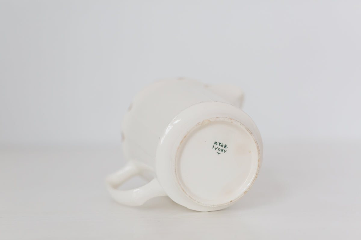 Vintage cream K T & K pitcher with gold accents