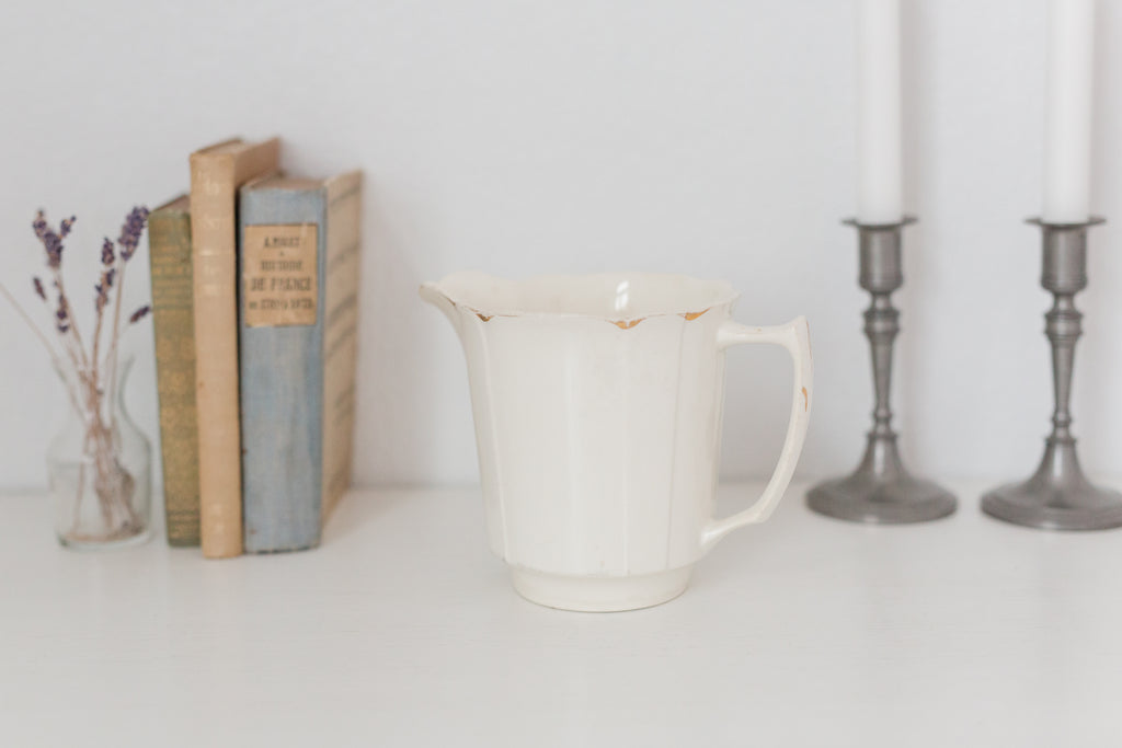 Vintage cream K T & K pitcher with gold accents