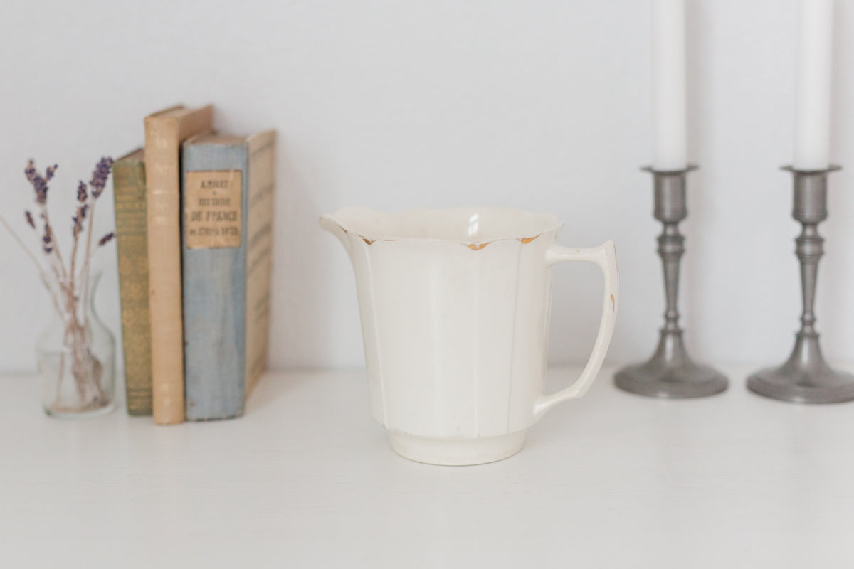 Vintage cream K T & K pitcher with gold accents