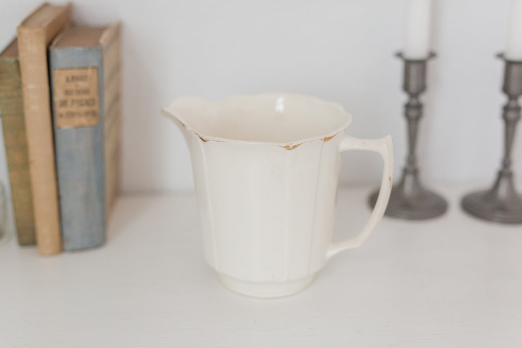 Vintage cream K T & K pitcher with gold accents
