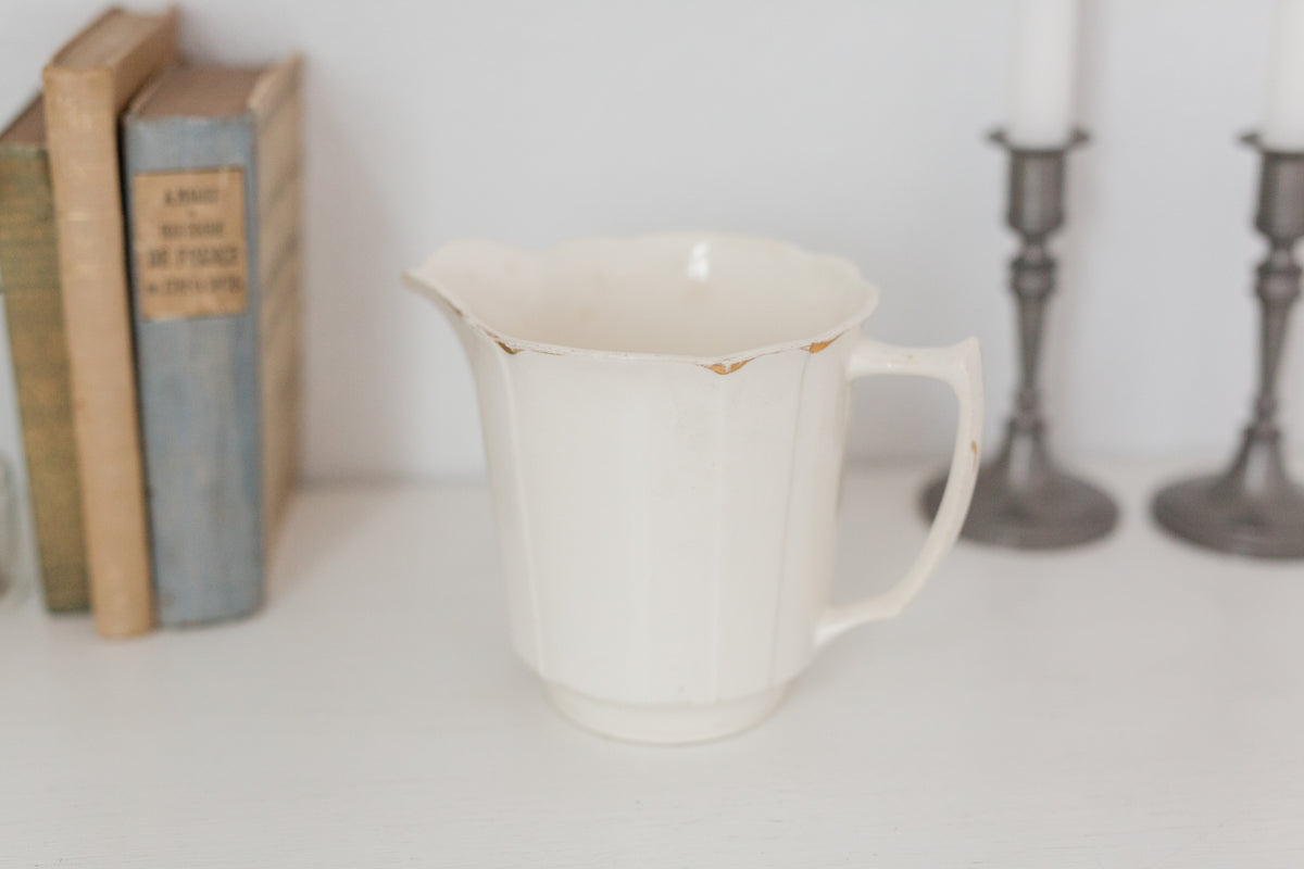 Vintage cream K T & K pitcher with gold accents