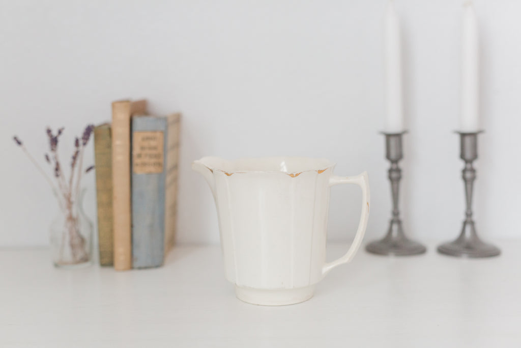 Vintage cream K T & K pitcher with gold accents