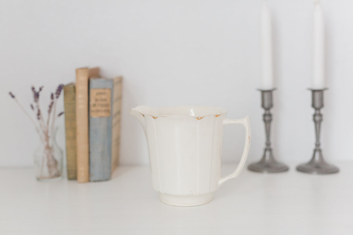 Vintage cream K T & K pitcher with gold accents