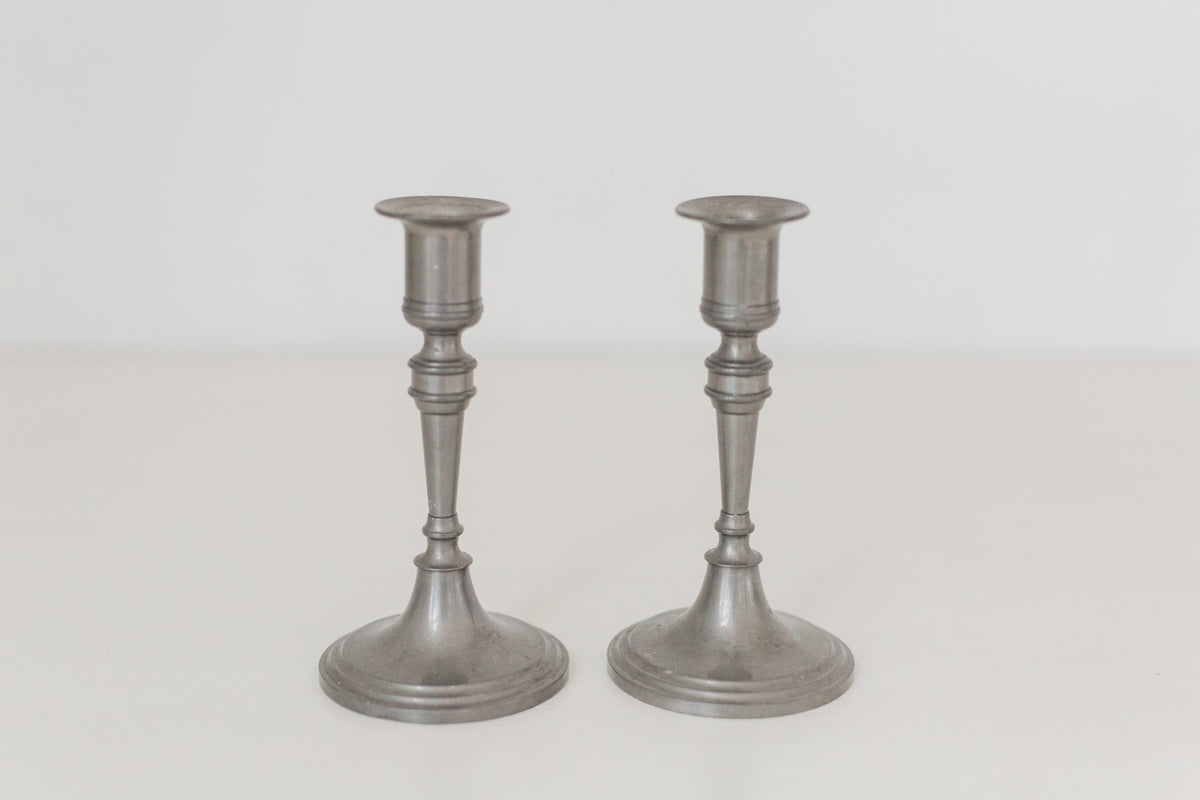 Vintage pair of pewter candle stick holders