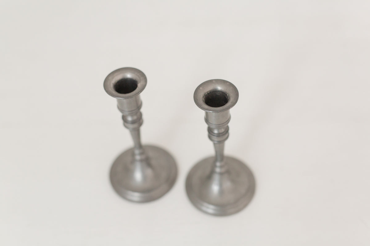 Vintage pair of pewter candle stick holders