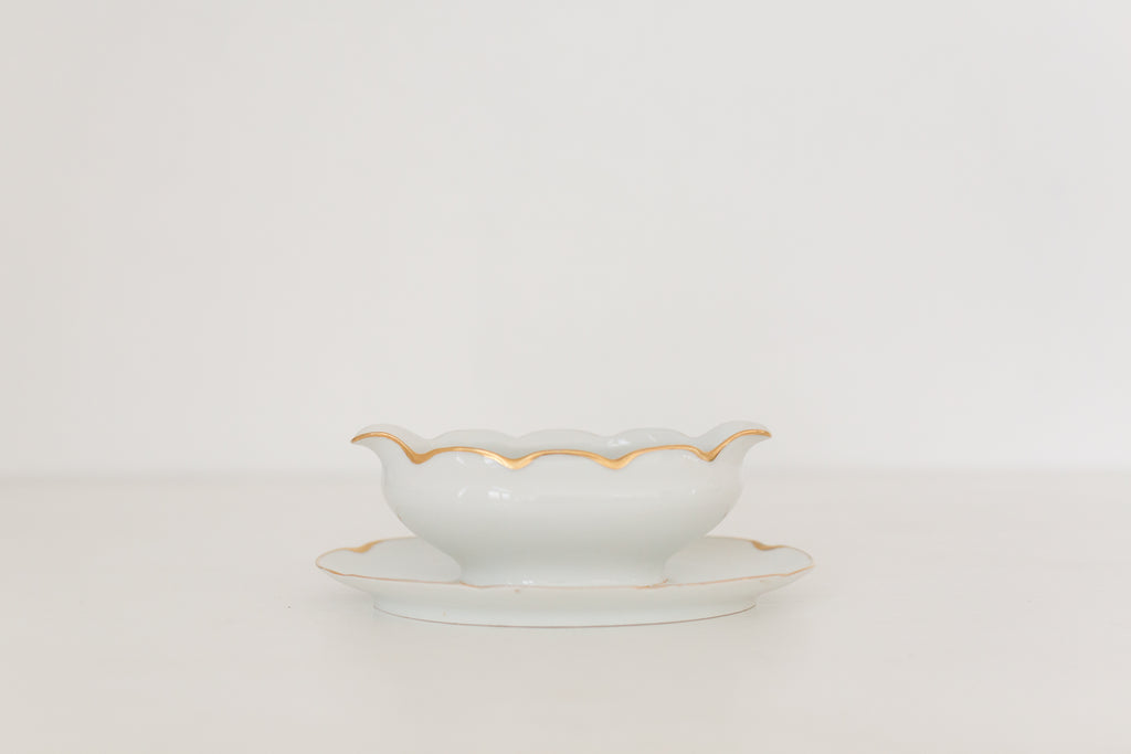 Vintage gravy boat with gold edging