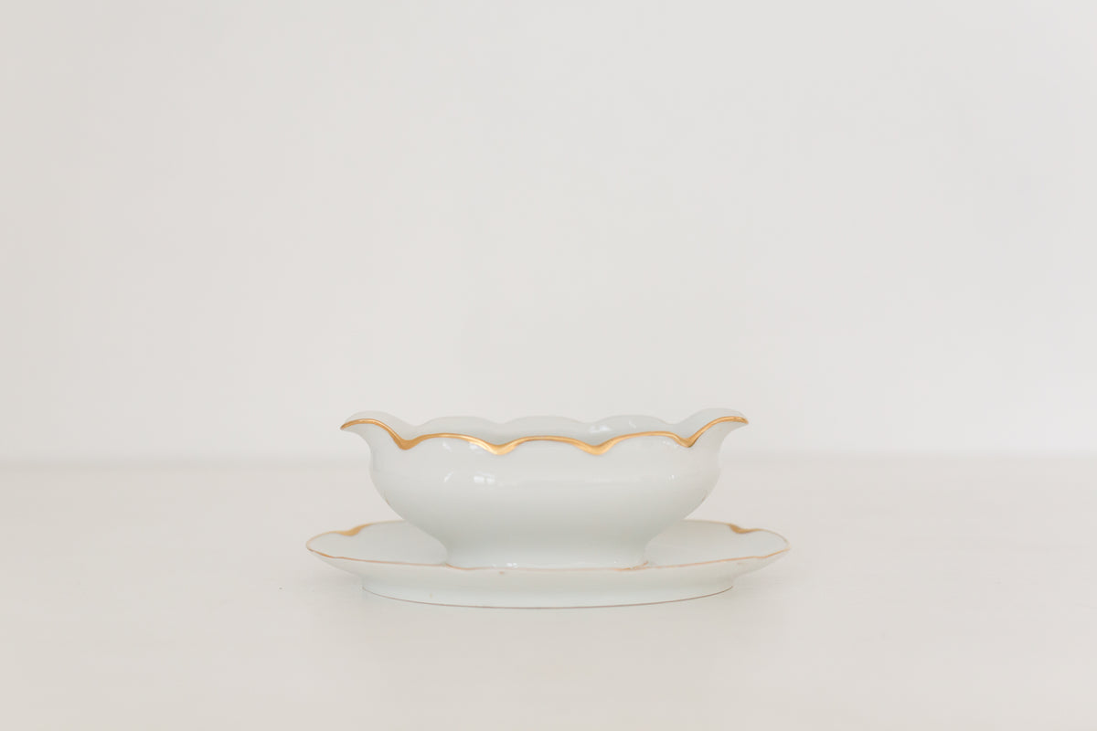 Vintage gravy boat with gold edging