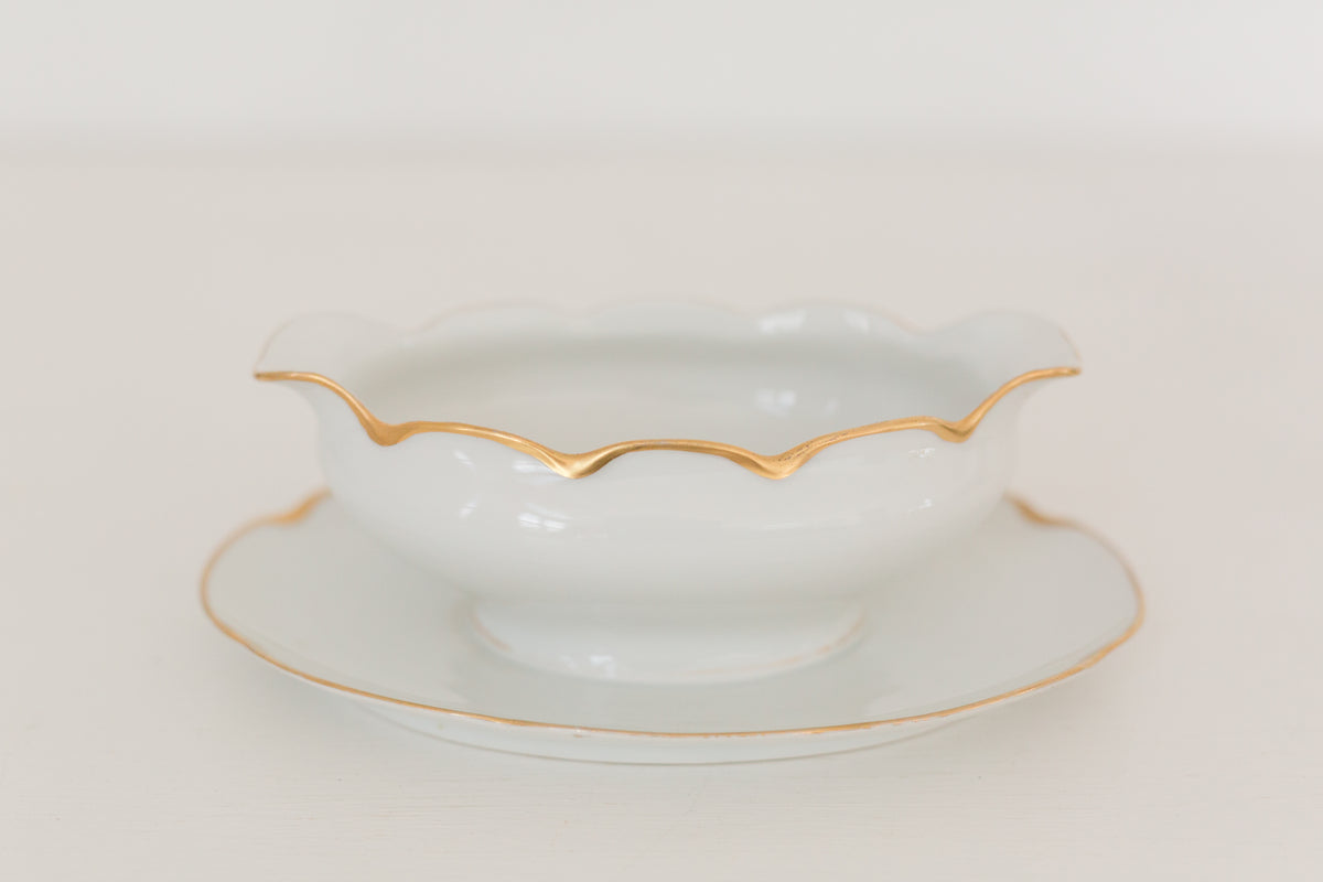 Vintage gravy boat with gold edging