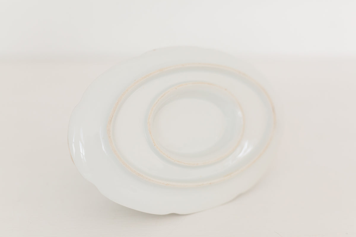 Vintage gravy boat with gold edging