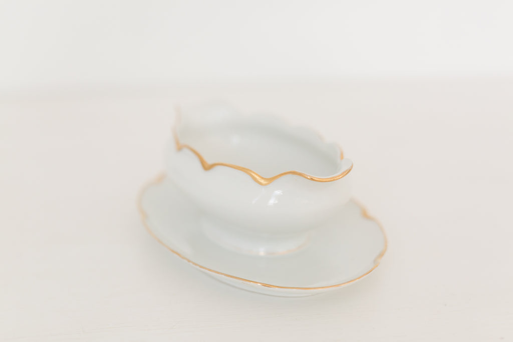 Vintage gravy boat with gold edging