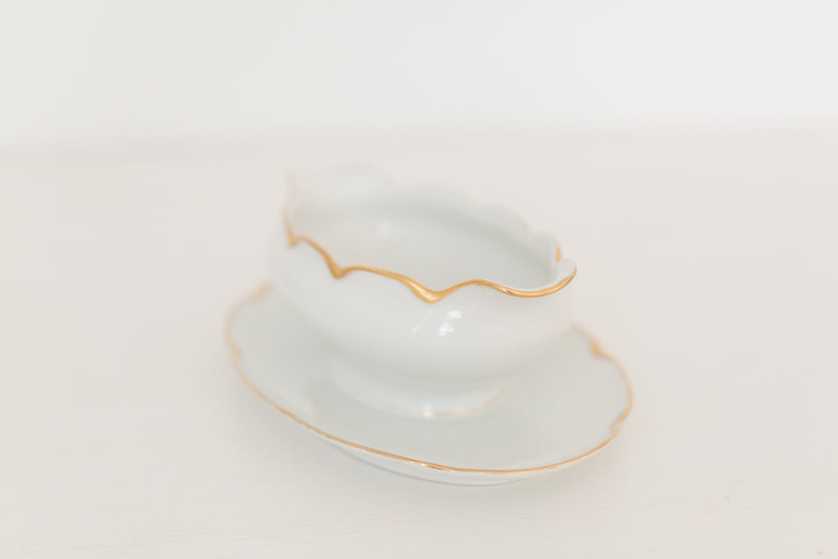 Vintage gravy boat with gold edging