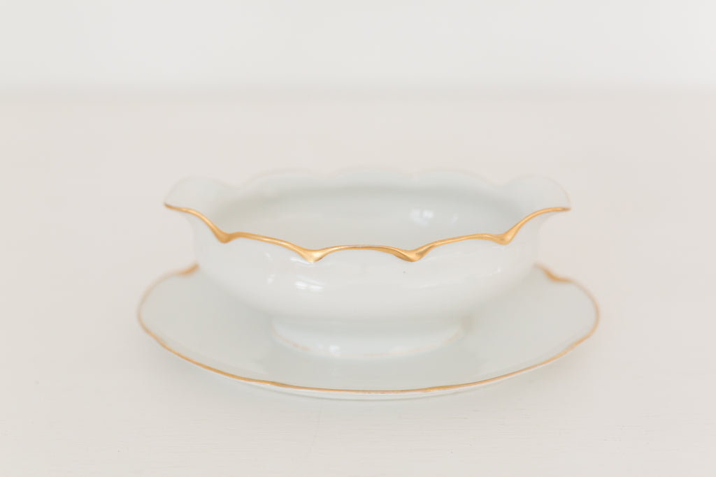 Vintage gravy boat with gold edging