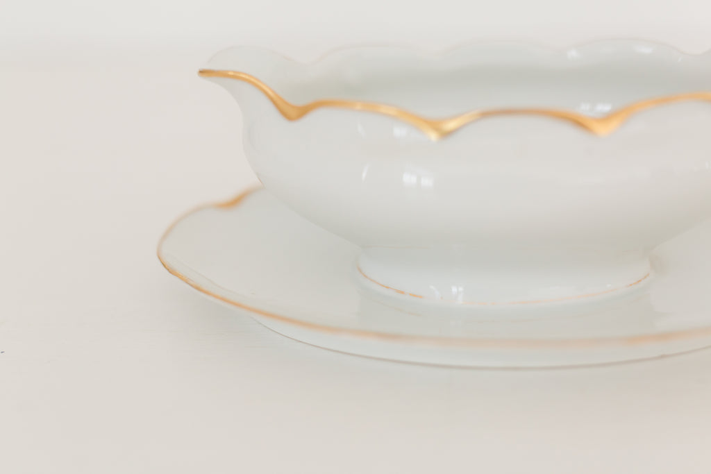 Vintage gravy boat with gold edging