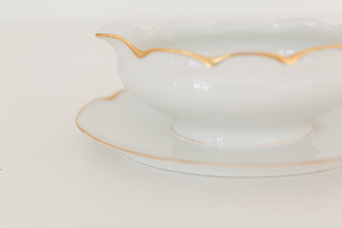 Vintage gravy boat with gold edging