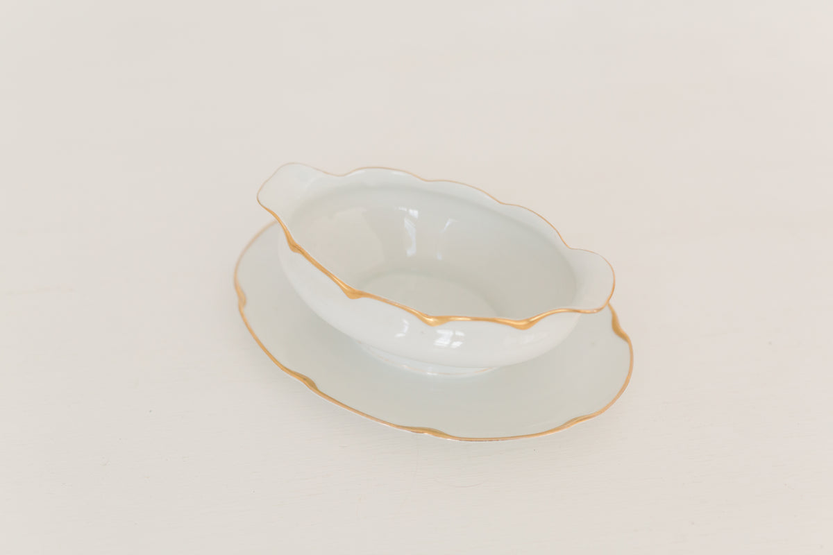 Vintage gravy boat with gold edging