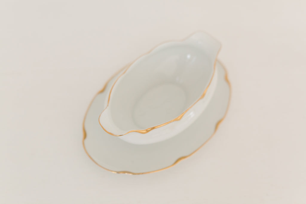 Vintage gravy boat with gold edging