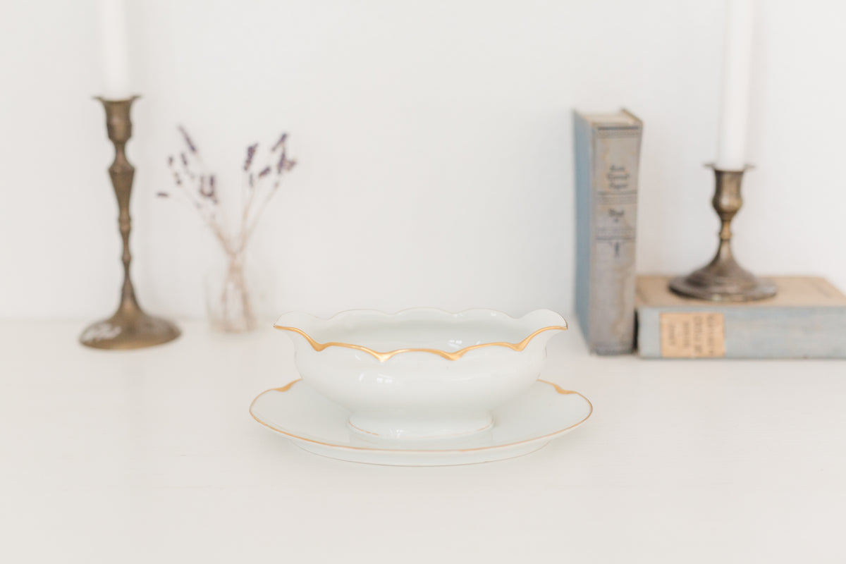 Vintage gravy boat with gold edging