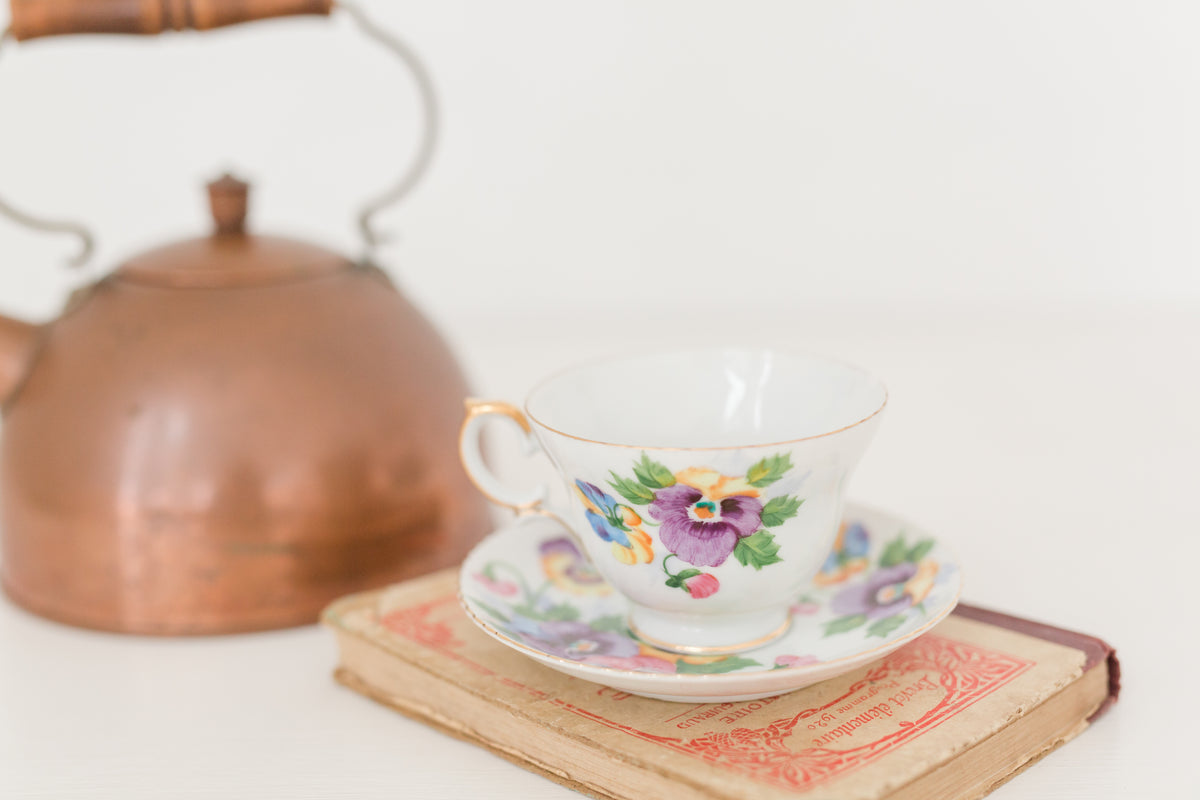 Vintage hand painted floral tea cup and saucer