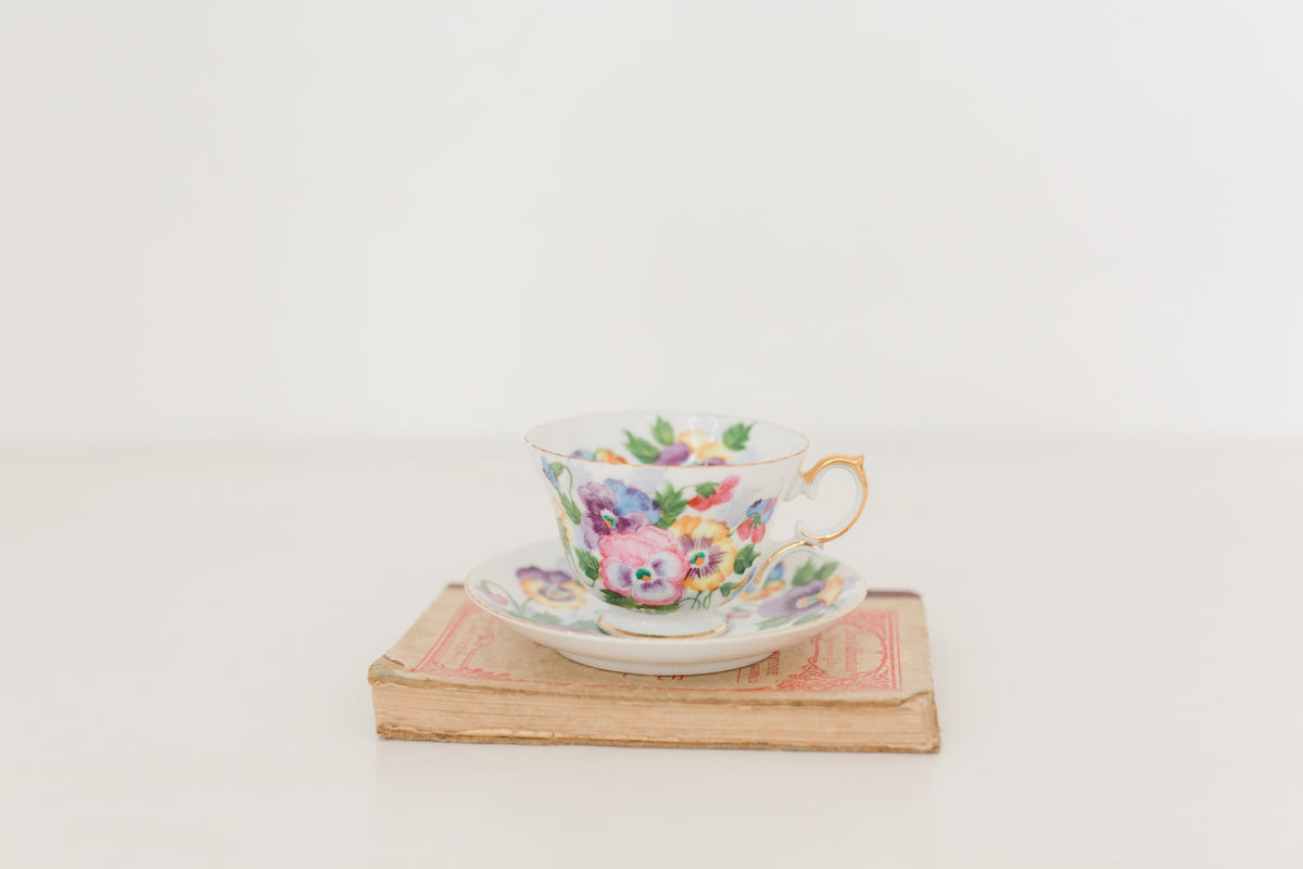 Vintage hand painted floral tea cup and saucer