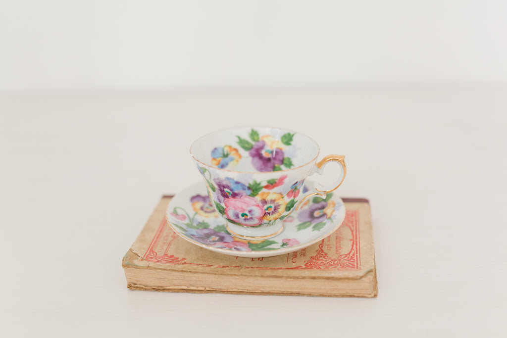 Vintage hand painted floral tea cup and saucer