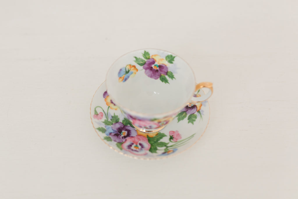Vintage hand painted floral tea cup and saucer