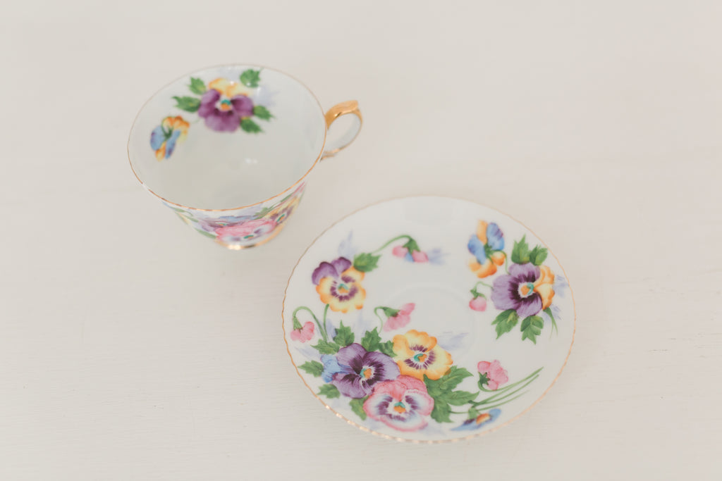 Vintage hand painted floral tea cup and saucer