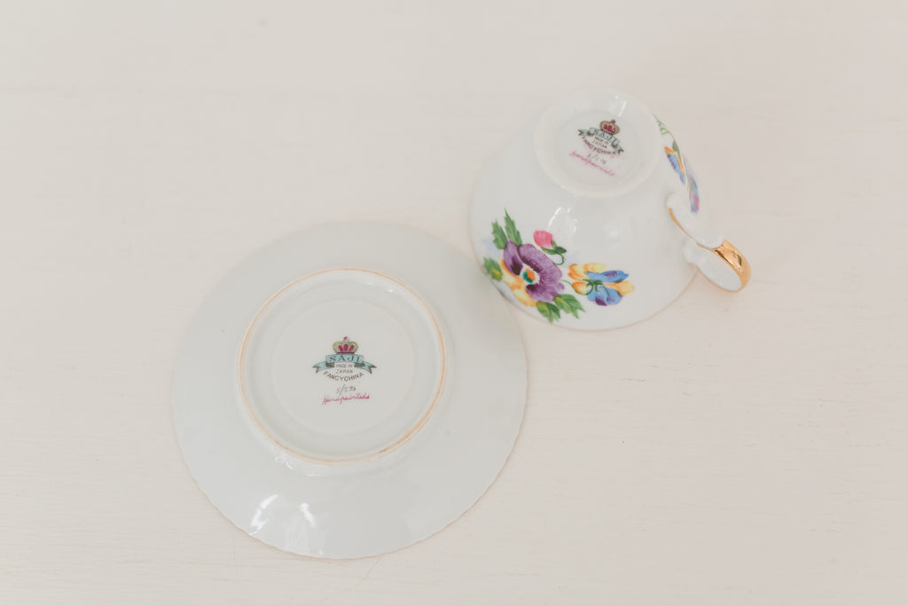 Vintage hand painted floral tea cup and saucer