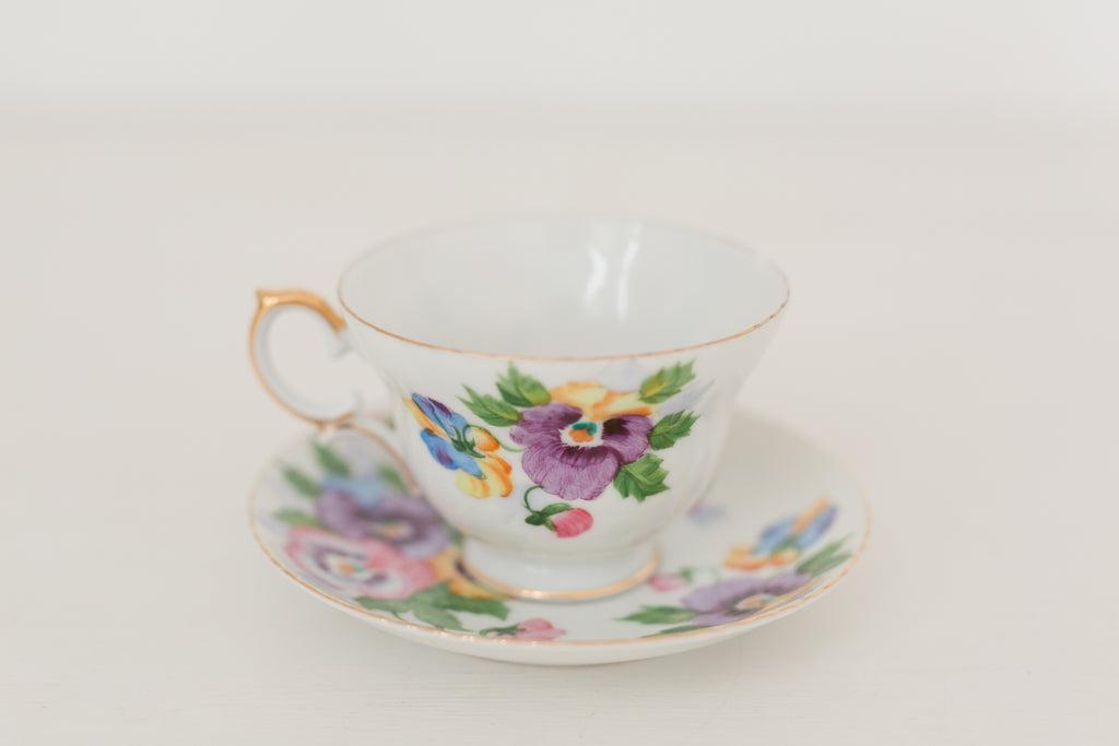 Vintage hand painted floral tea cup and saucer