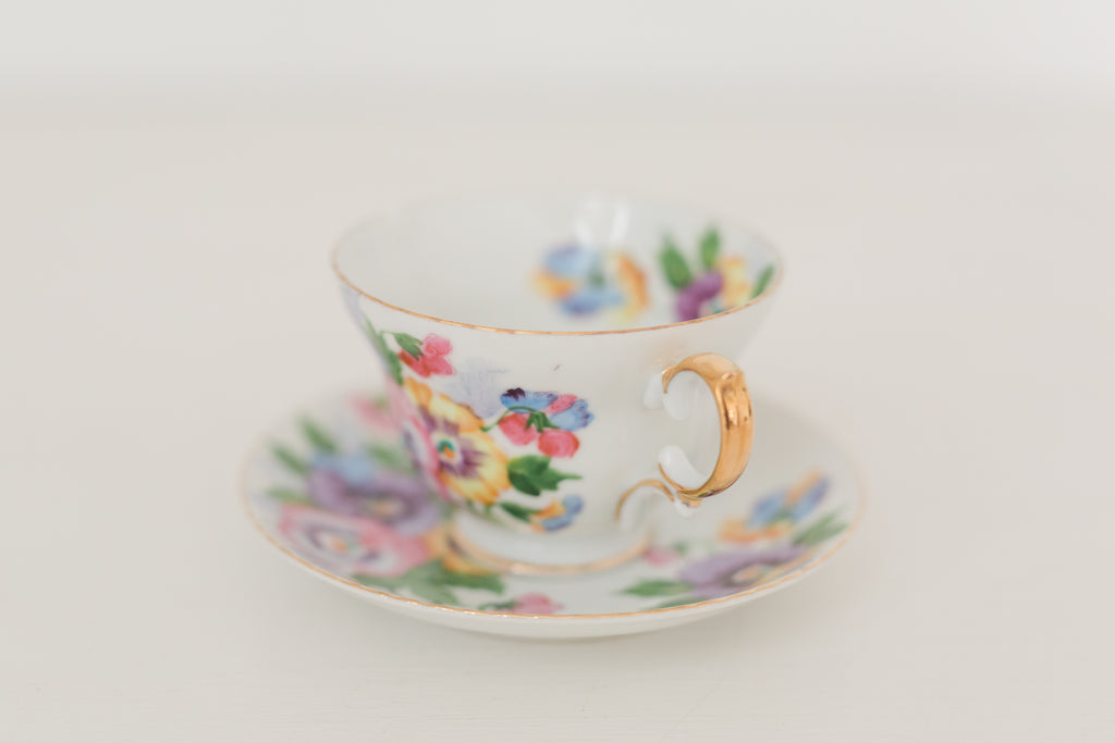 Vintage hand painted floral tea cup and saucer