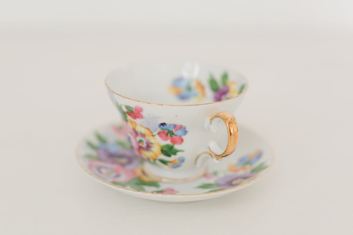 Vintage hand painted floral tea cup and saucer