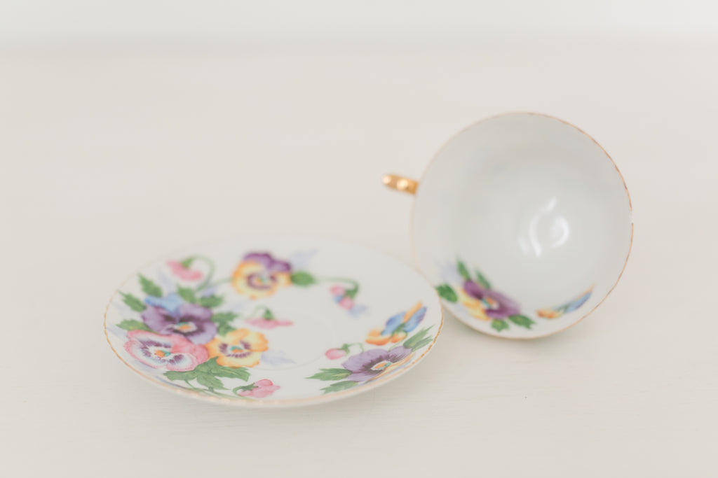 Vintage hand painted floral tea cup and saucer
