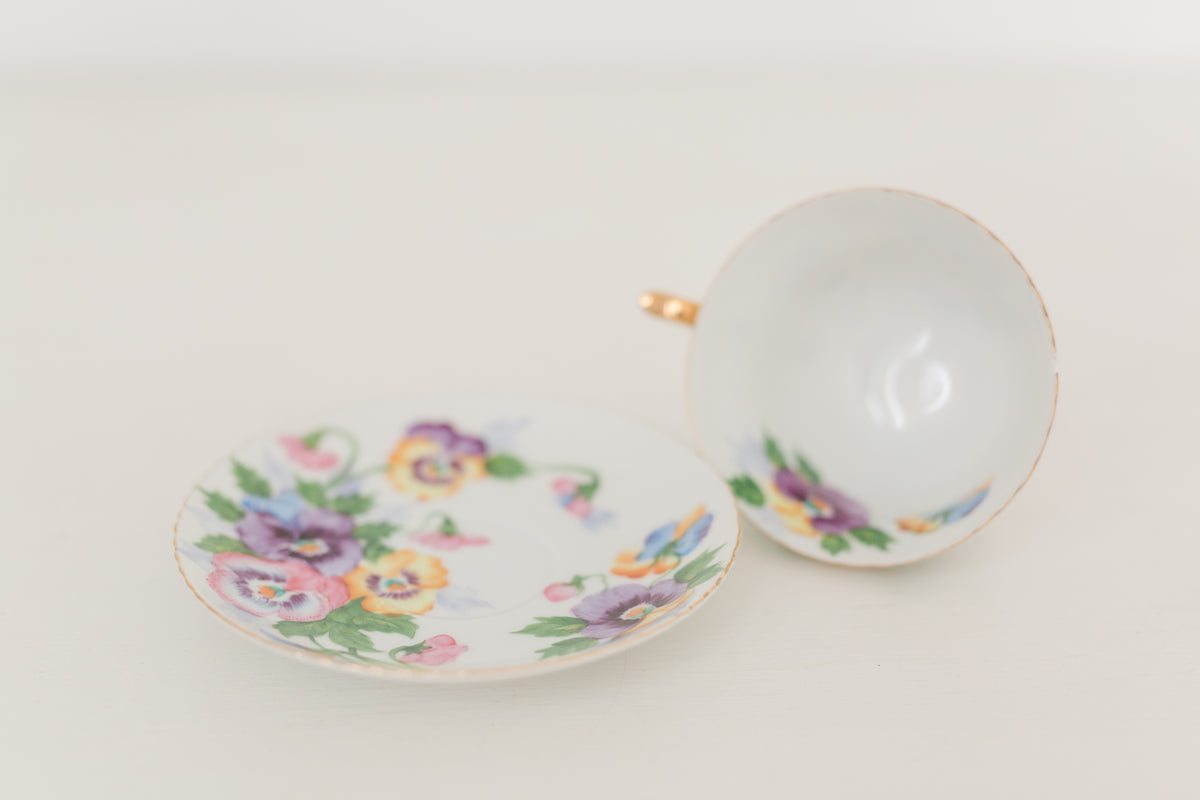 Vintage hand painted floral tea cup and saucer